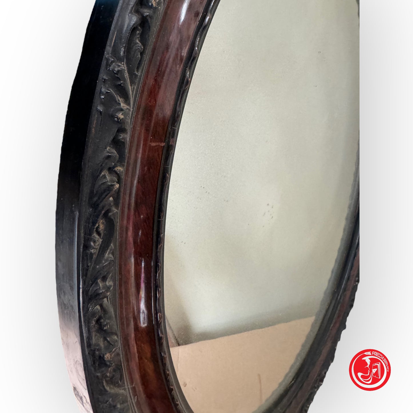 Oval mirror with elegant wooden frame