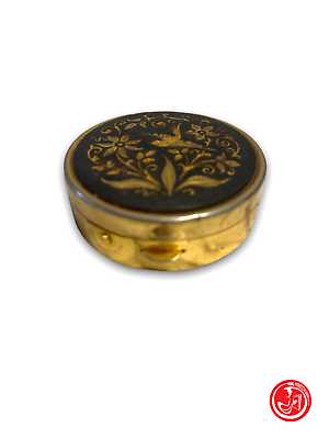 Golden pillbox with pattern