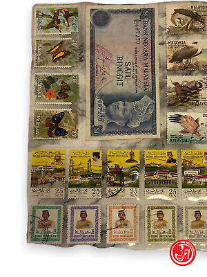 Malaysia stamp collection with coins and banknotes