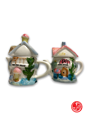 Two small house-shaped teapots