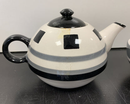 Teapot with matching cup