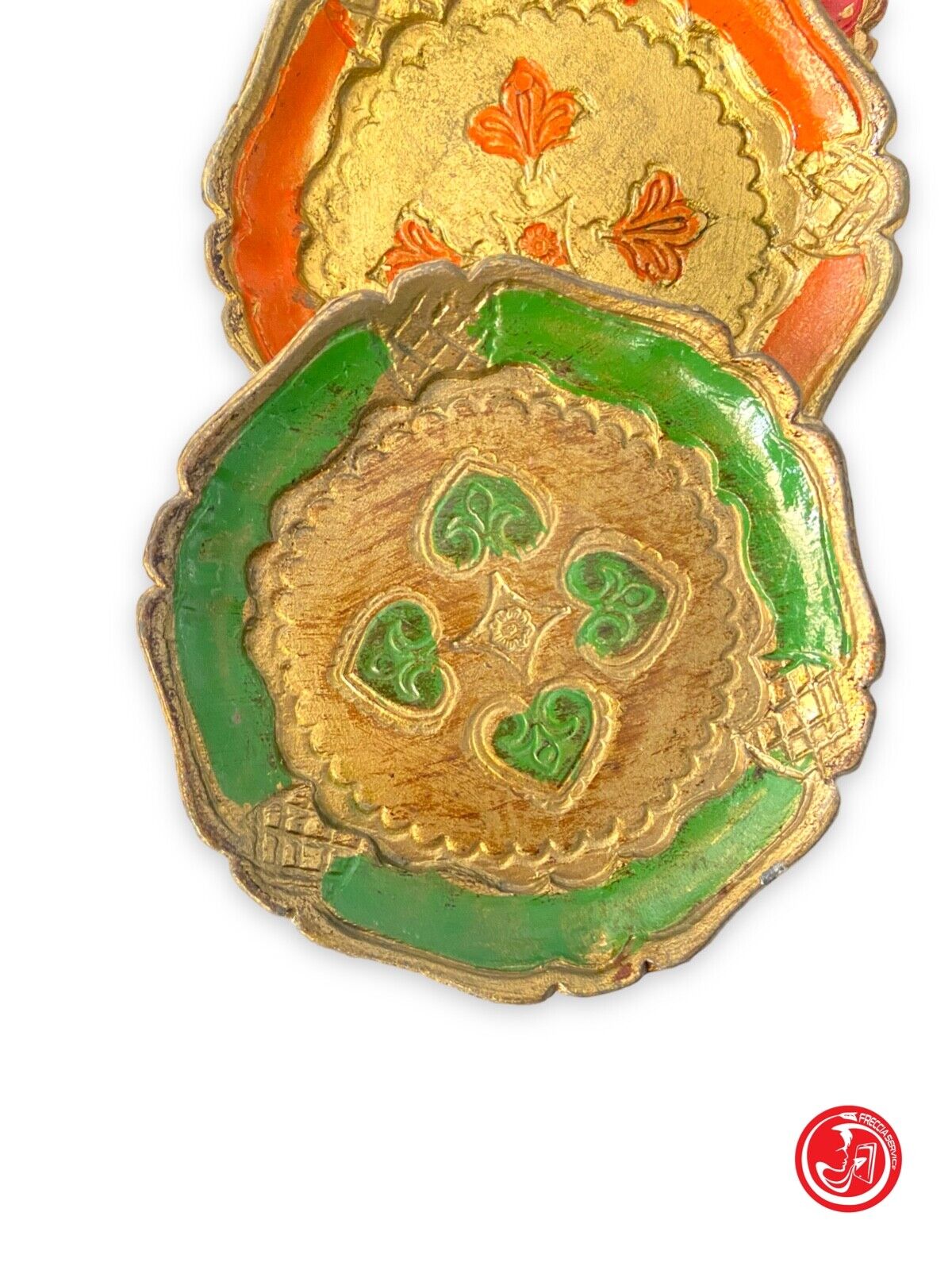 Trio of wooden plates with engraved decorations