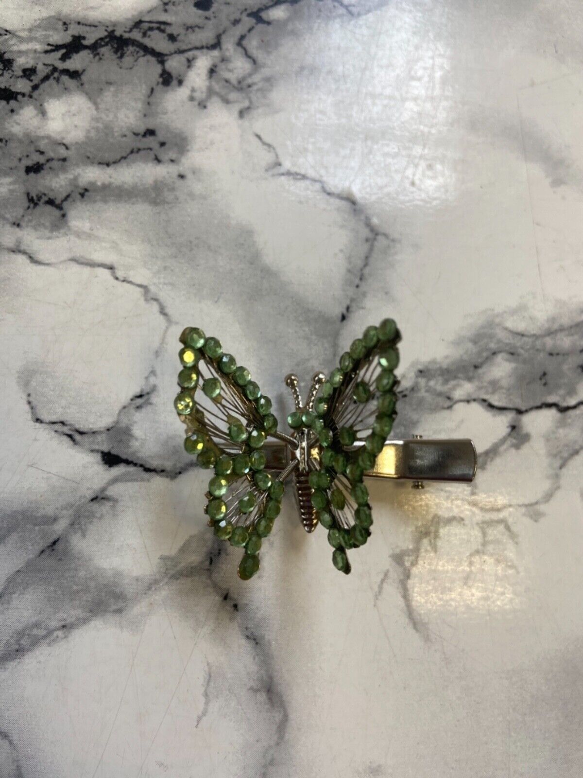 Hair tweezers with green butterfly