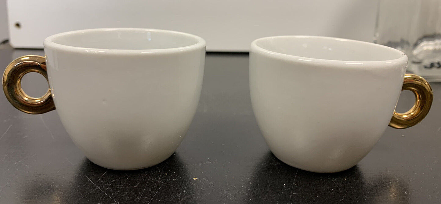 Coffee cup with golden handle