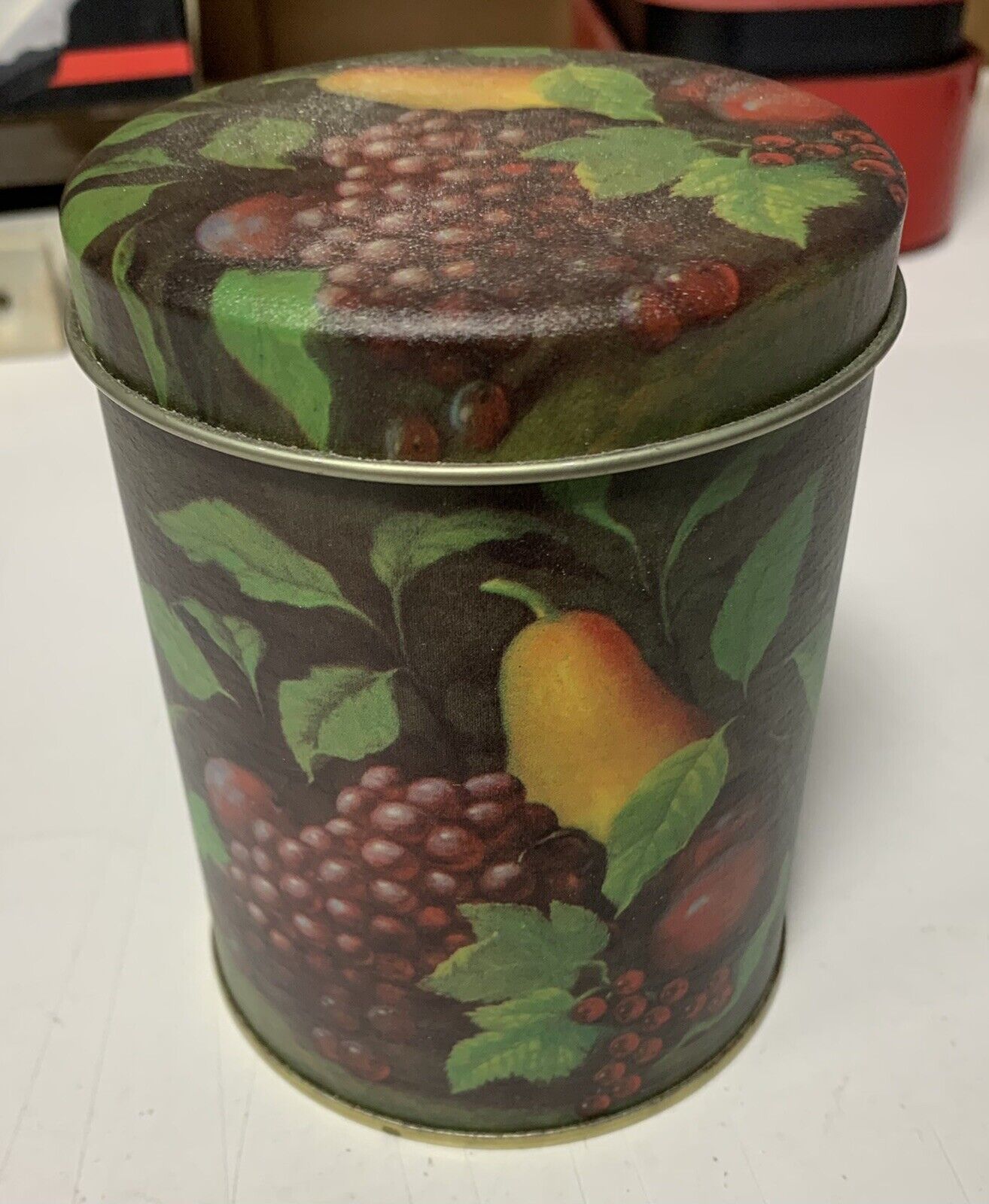 Decorated cylinder tin box