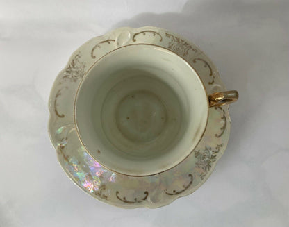 Arte - Tazza con piattino in porcellana decorata