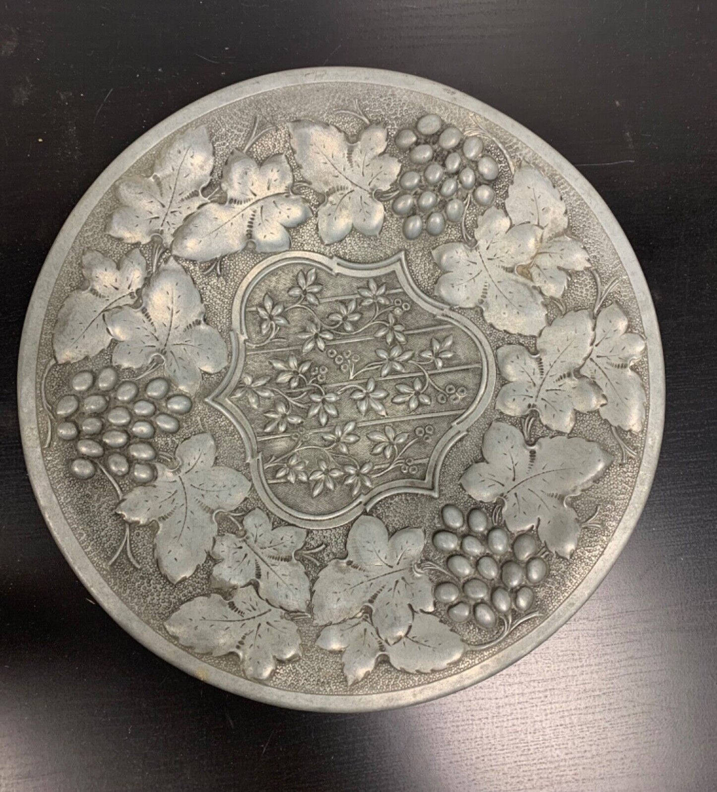 Ornate pewter wall art 