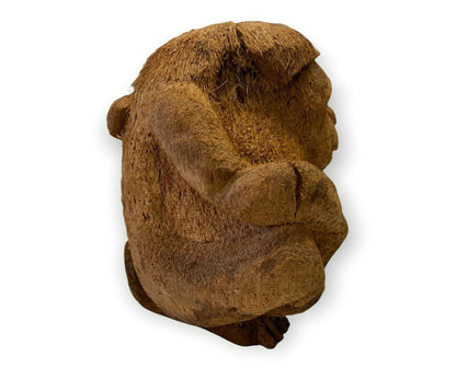 Chimpanzee sculpture with wood scraps